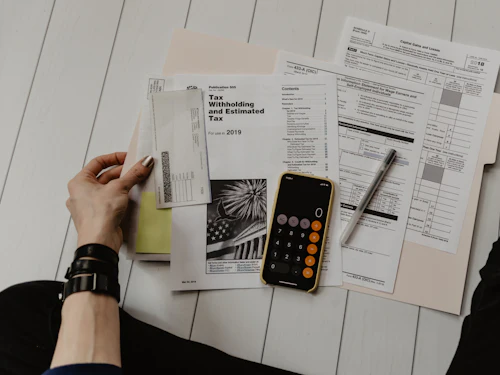 Property documents and a calculator on a desk