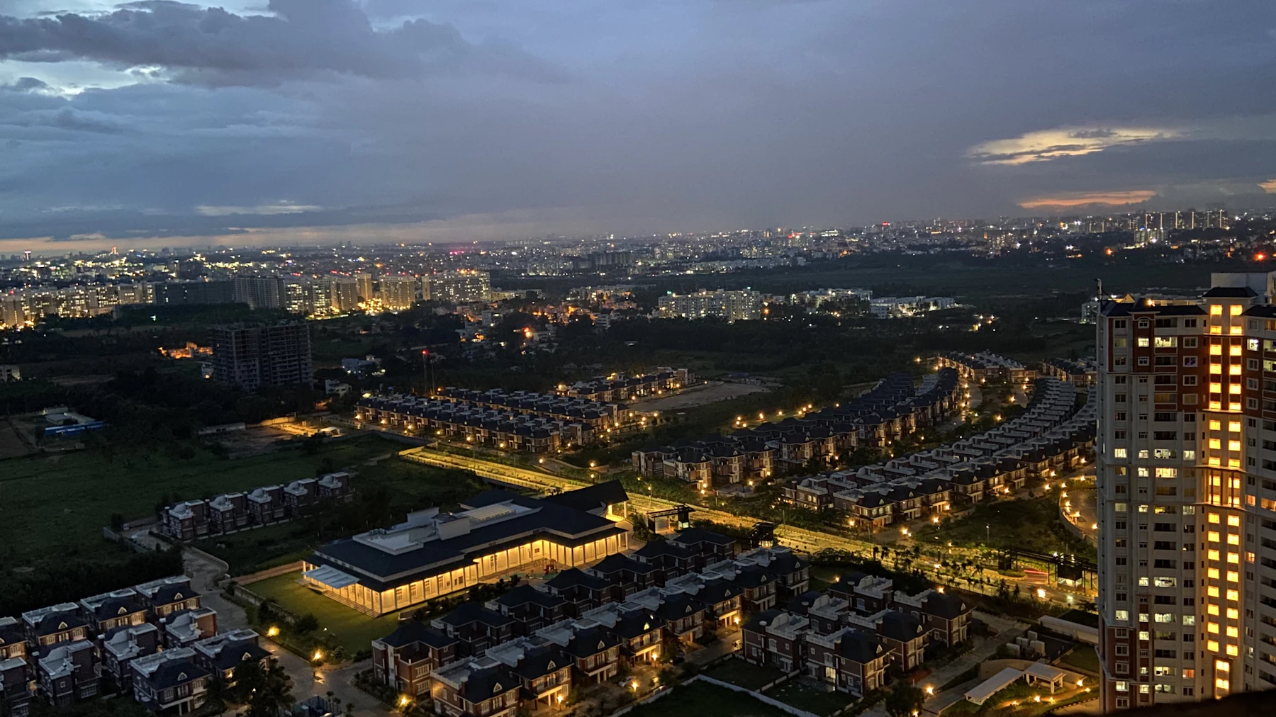 Indian city skyline at dusk with new residential and commercial development